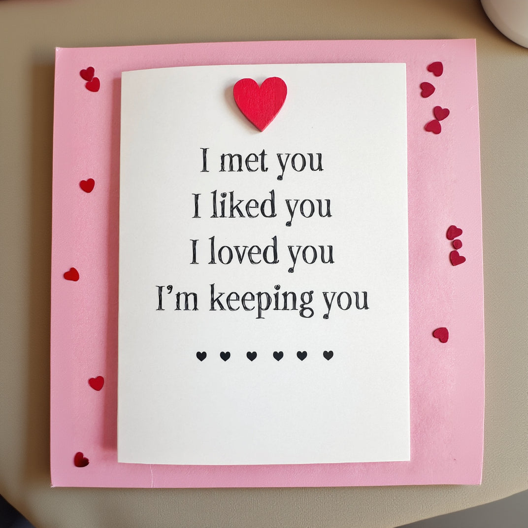 A white greeting card with the phrase 'I met you. I liked you.